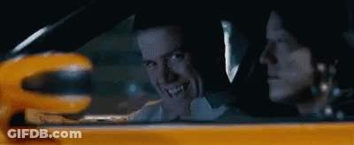 Man And Woman Driving Yellow Car GIF
