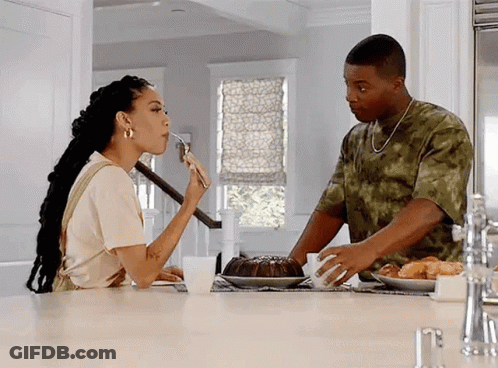 Man And Woman Eating At Kitchen Table GIF