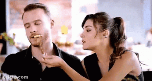 Man And Woman Eating At Table GIF