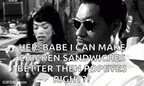 Man And Woman Eating Chicken Sandwiches GIF
