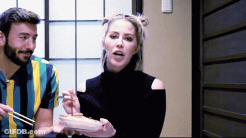 Man And Woman Eating Food With Chopsticks GIF