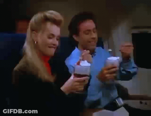 Man And Woman Eating Ice Cream On Plane GIF