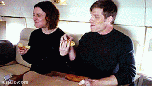 Man And Woman Eating Pizza GIF
