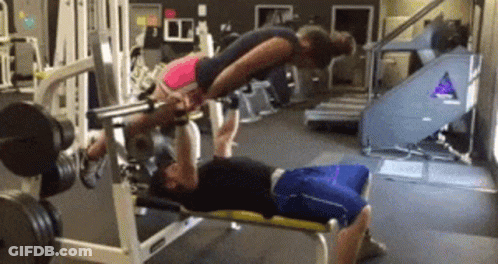 Man And Woman Exercising On Gym Bench GIF