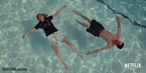 Man And Woman Floating In Pool Netflix GIF