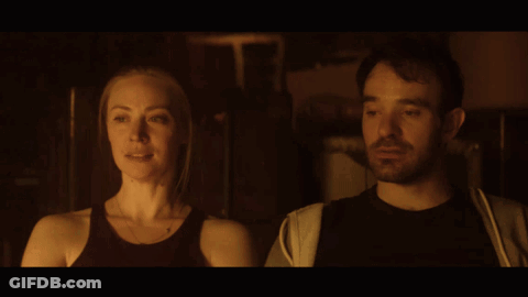 Man And Woman Gazing In Dark Room GIF