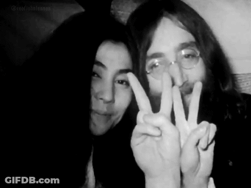 Man And Woman Giving Peace Sign GIF