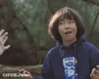 Man And Woman High-Fiving With Popcorn GIF