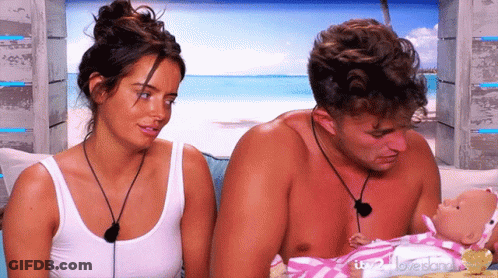 Man And Woman Holding Baby Doll Saying Love Island GIF