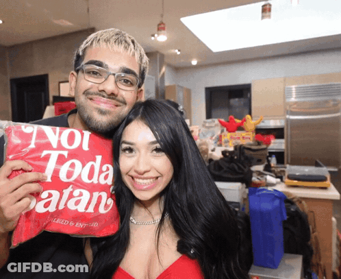 Man And Woman Holding Bag Saying Not Toda Satan GIF