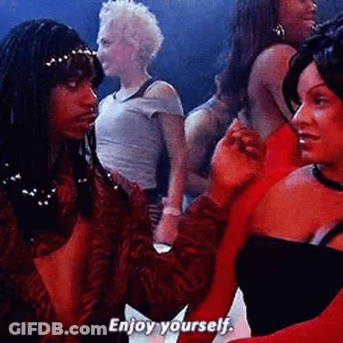 Man And Woman Holding Hands In Crowd Saying Enjoy Yourself GIF