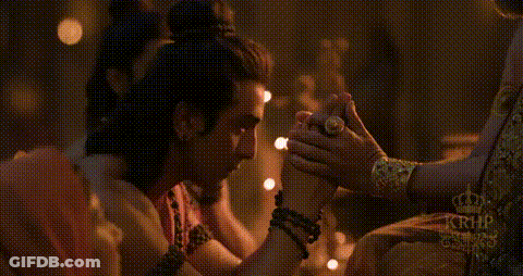Man And Woman Holding Hands In Dark Room GIF