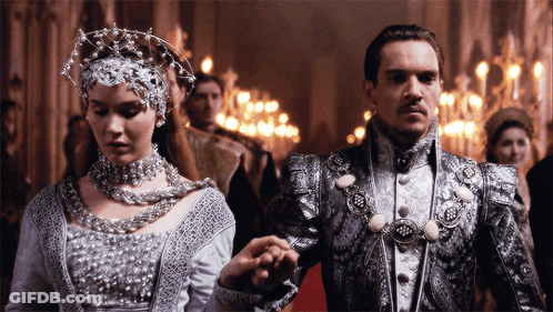 Man And Woman Holding Hands In Hallway GIF