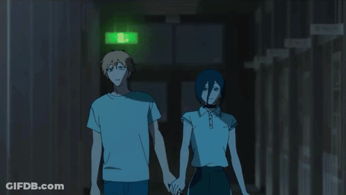 Man And Woman Holding Hands In Hallway With Green Exit Sign GIF