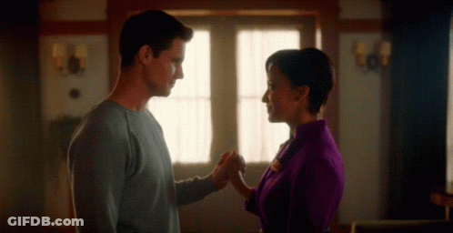 Man And Woman Holding Hands In Living Room GIF