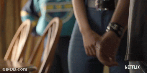 Man And Woman Holding Hands In Netflix Trailer GIF