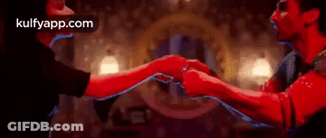 Man And Woman Holding Hands In Room GIF