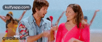 Man And Woman Holding Hands On Beach GIF