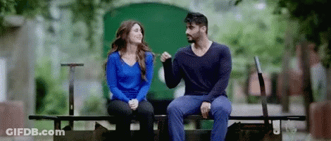 Man And Woman Holding Hands On Bench GIF
