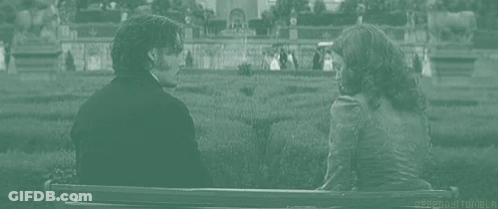 Man And Woman Holding Hands On Bench GIF