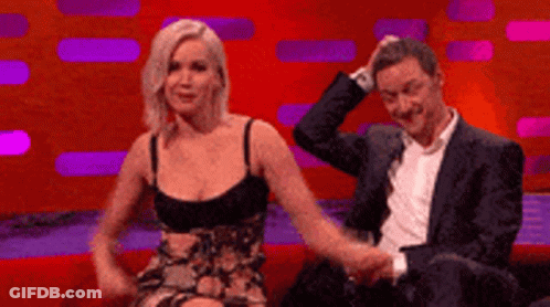 Man And Woman Holding Hands On Couch GIF