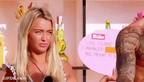 Man And Woman Holding Sign GIF