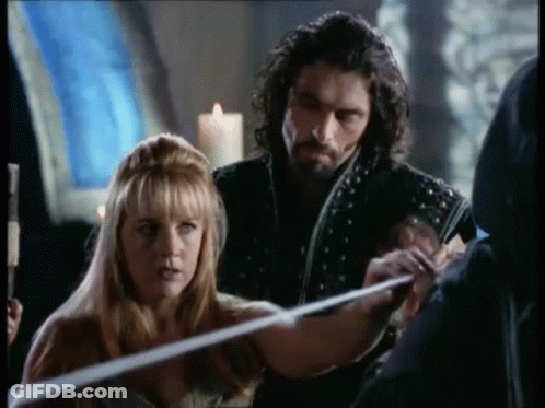 Man And Woman Holding Sword GIF