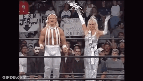 Man And Woman Holding Twin Killing Sign GIF