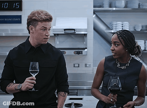 Man And Woman Holding Wine Glasses GIF
