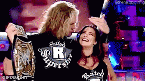 Man And Woman Holding Wrestling Championship Belt GIF