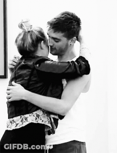 Man And Woman Hugging And Kissing In Black And White GIF