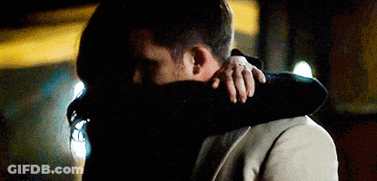 Man And Woman Hugging And Kissing In Dark Room GIF