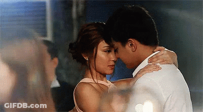 Man And Woman Hugging And Kissing In Room GIF