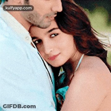 Man And Woman Hugging And Kissing On Cheek GIF