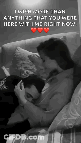 Man And Woman Hugging And Kissing On Couch GIF