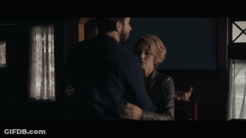 Man And Woman Hugging And Looking At Each Other GIF