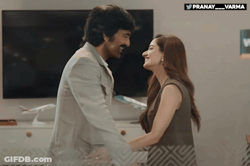 Man And Woman Hugging And Looking At Each Other GIF