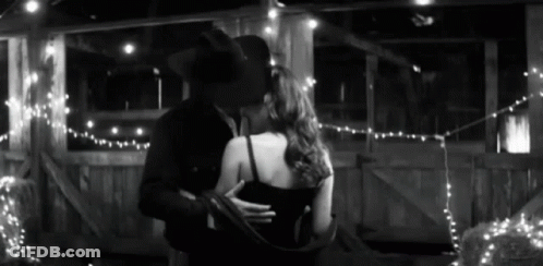 Man And Woman Hugging At Table GIF