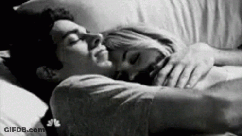 Man And Woman Hugging In Bed GIF