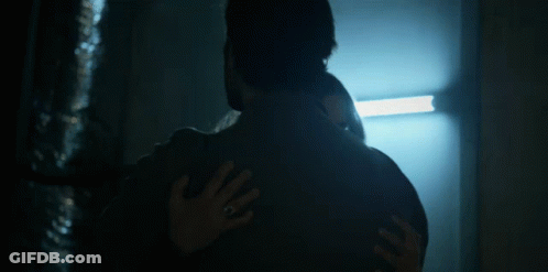 Man And Woman Hugging In Dark Room GIF