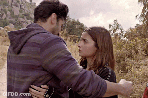 Man And Woman Hugging In Field GIF