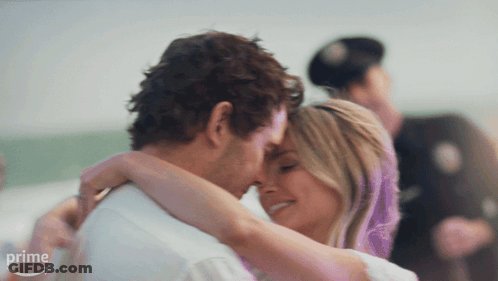 Man And Woman Hugging In Front Of Prime Sign GIF
