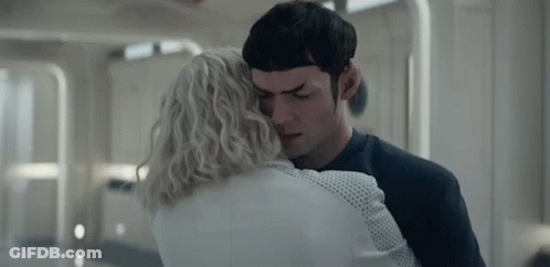 Man And Woman Hugging In Hallway GIF