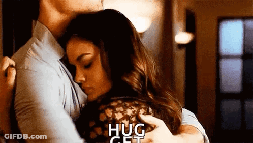 Man And Woman Hugging In Living Room GIF