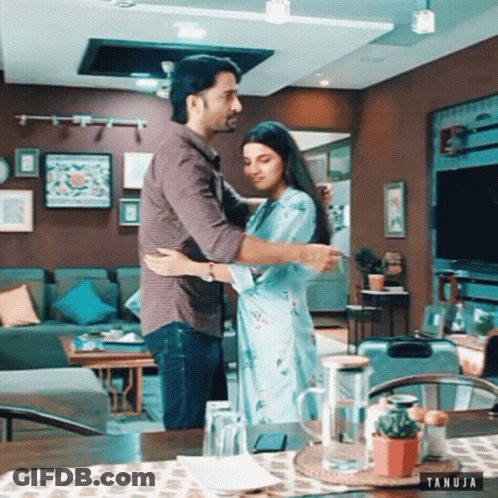 Man And Woman Hugging In Living Room Tanuja GIF