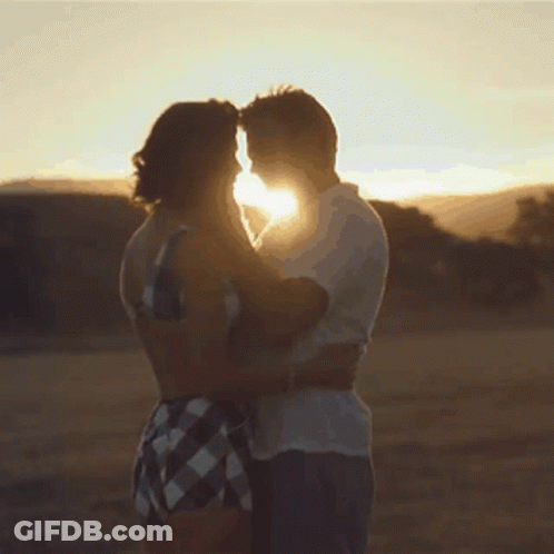 Man And Woman Hugging In Sunlight GIF