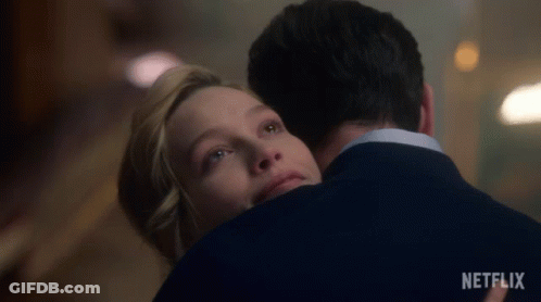 Man And Woman Hugging Netflix Logo GIF