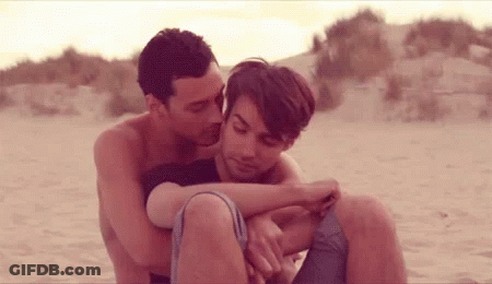 Man And Woman Hugging On Beach GIF