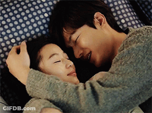 Man And Woman Hugging On Bed GIF