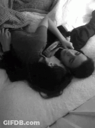 Man And Woman Hugging On Bed GIF